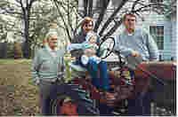 4 Generations with Ben at 4 months; Howard McKee, Chris Weide, Ben Weide,
      Nelson E. Weide; taken on 1950 Farmall Cub tractor Glenwood, Iowa; Oct. 1988